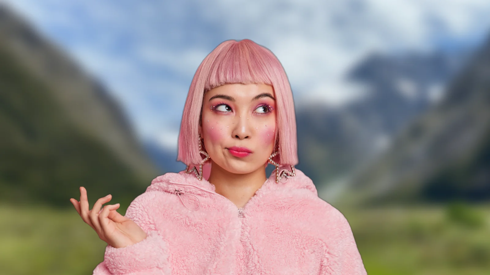 Creator with pink hair and a pink jacket